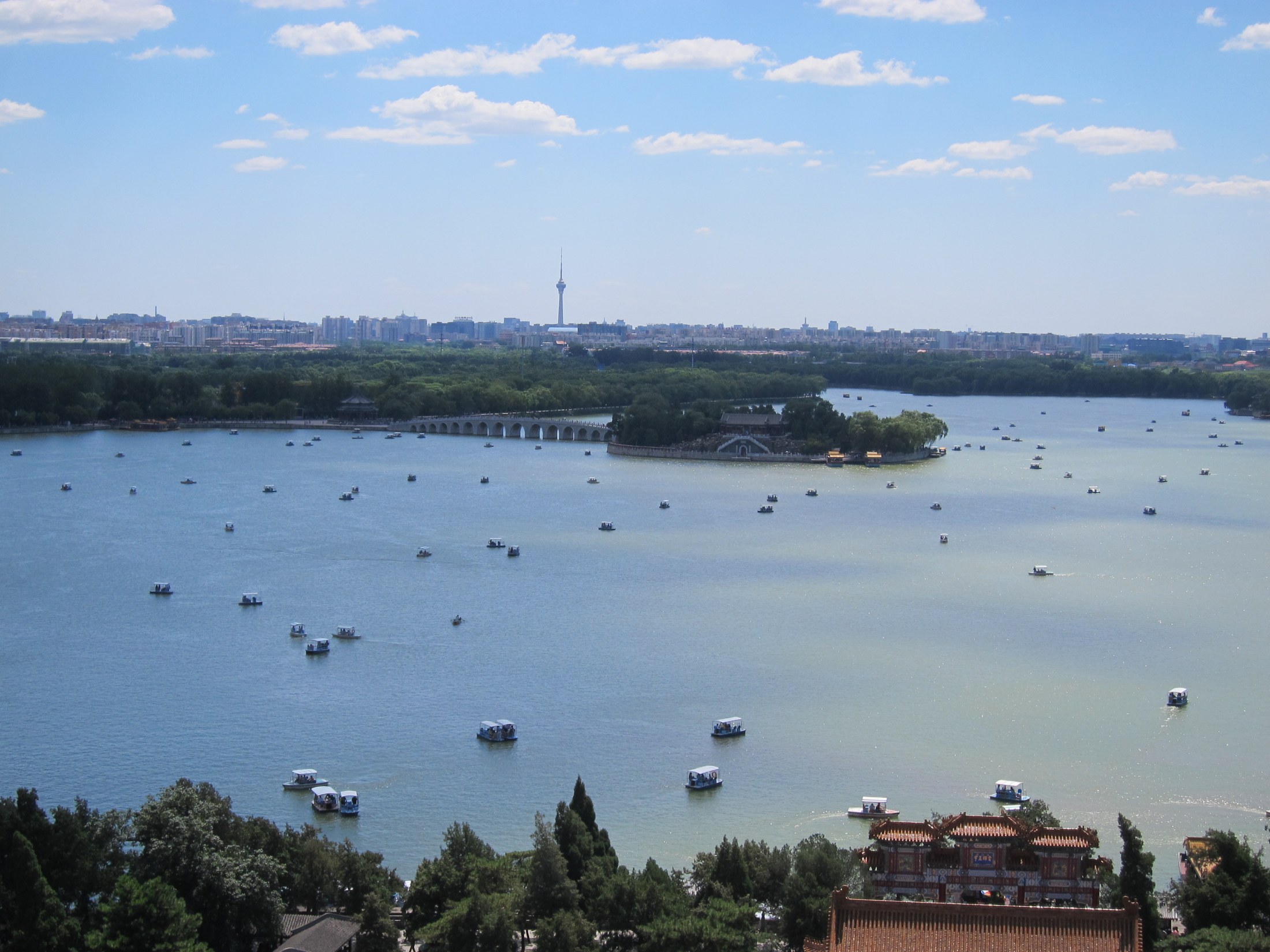 Kunming Lake at the Summer Palace, with boats, an island and a traditional gateway